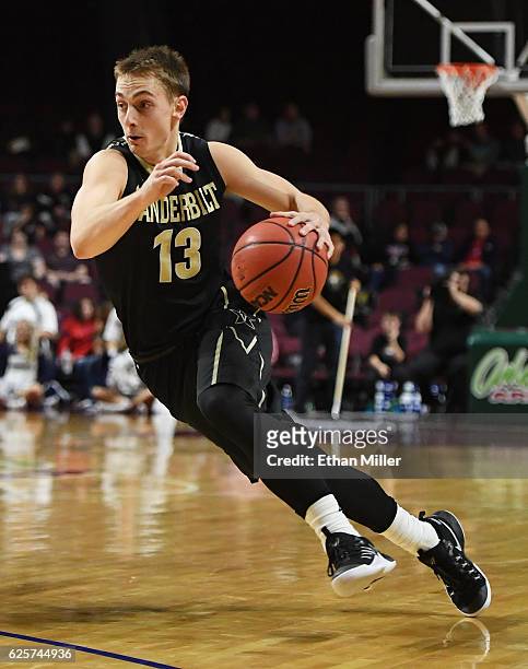 Riley LaChance of the Vanderbilt Commodores drives against the Butler Bulldogs during the 2016 Continental Tire Las Vegas Invitational basketball...