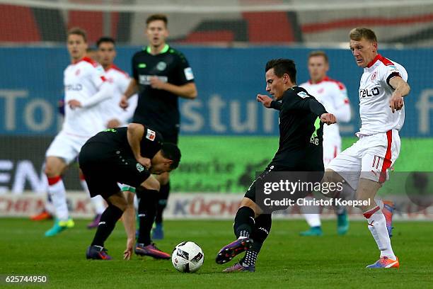 Axel Bellinghausen of Duesseldorf challenges Stefan Strandberg of Hannover during the Second Bundesliga match between Fortuna Duesseldorf and...