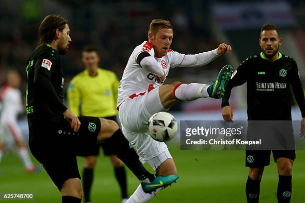 Rouwen hennings of Duesseldorf challenges Stefan Strandberg of Hannover during the Second Bundesliga match between Fortuna Duesseldorf and Hannover...