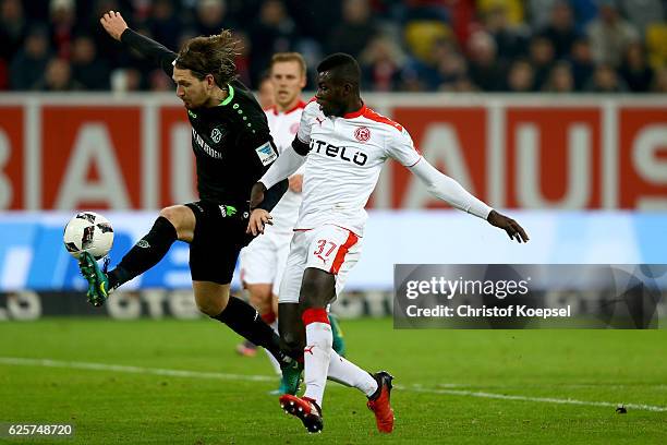 Ihlas Bebou of Duesseldorf challenges Stefan Strandberg of Hannover during the Second Bundesliga match between Fortuna Duesseldorf and Hannover 96 at...