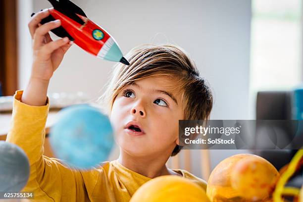 playing with his rocket - rocket science stock pictures, royalty-free photos & images