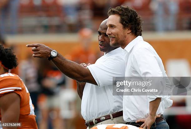 Head coach Charlie Strong of the Texas Longhorns talks with actor Matt McConaughey before the game against the TCU Horned Frogs at Darrell K Royal...