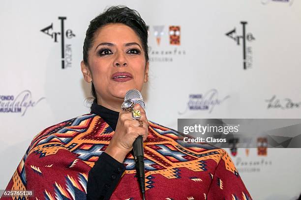 Mexican Singer Lila downs speaks at a press conference presenting the new alcoholic drink "Arte Mezcal" at Los Danzantes Restaurant on November 24,...