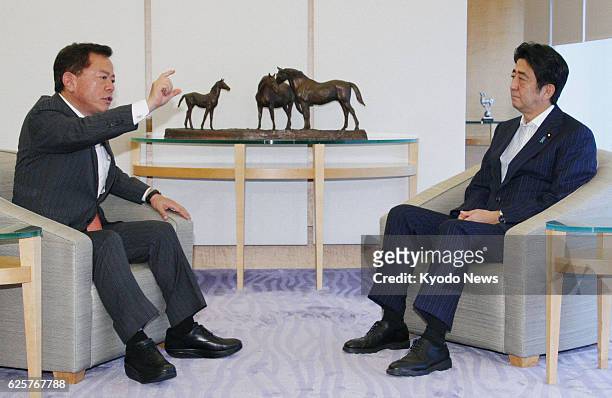 Japan - Tokyo Gov. Naoki Inose and Prime Minister Shinzo Abe hold talks at Abe's office in Tokyo on Sept. 11, 2013.