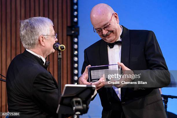 Rolf-Dieter Krause receives the 'Preis der Bundespressekonferenz' award from Gregor Mayntz during the 65th Bundespresseball at Hotel Adlon on...