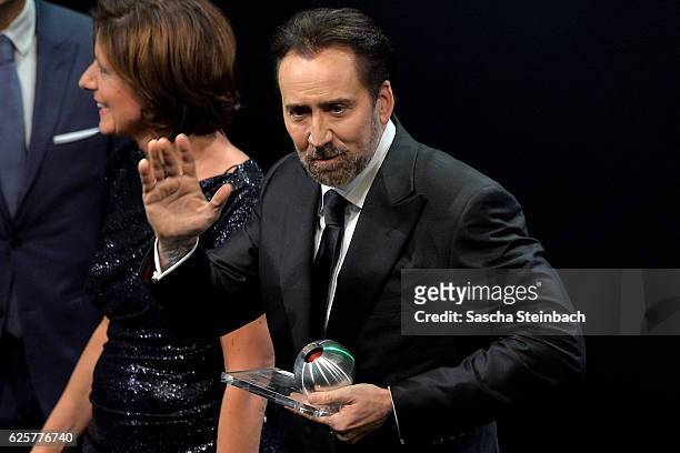 Nicolas Cage reacts after being awarded with the honorary award during the German Sustainability Award 2016 at Maritim Hotel on November 25, 2016 in...