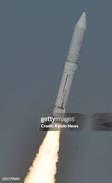 Japan - Photo taken from a Kyodo News helicopter shows Japan's new solid-fuel rocket Epsilon ascending in the sky after lifting off from the launch...