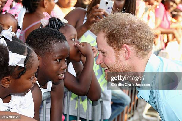 Prince Harry meets members of the public on the sixth day of an official visit on November 25, 2016 in Soufriere, Saint Lucia. Prince Harry's visit...