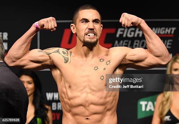 Robert Whittaker of New Zealand poses on the scale during the UFC weigh-in at Rod Laver Arena on November 26, 2016 in Melbourne, Australia.