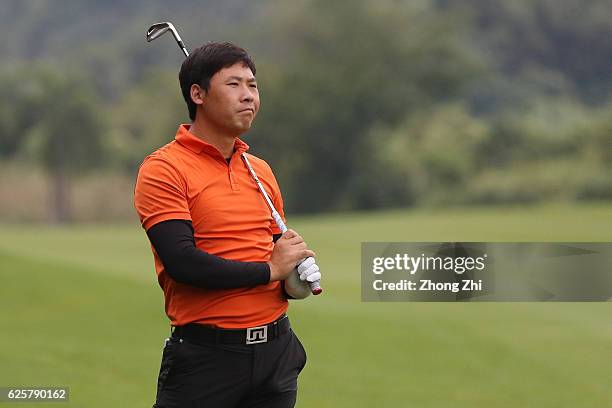 Xinjun Zhang of China reacts during the second round of the Buick open at Guangzhou Foison Golf Club on November 25, 2016 in Guangzhou, China.