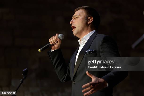 Russian baritone Vladislav Kosarev performs on stage during Russian Film Festival on November 25, 2016 in Honfleur, France.
