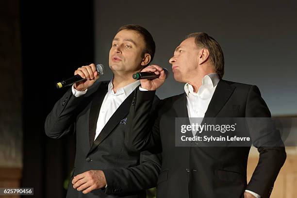 Russian baritone Vladislav Kosarev and actor Aleksei Guskov perform on stage during Russian Film Festival on November 25, 2016 in Honfleur, France.
