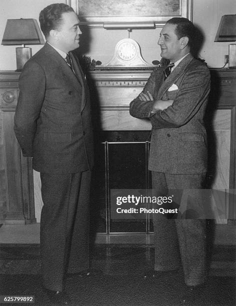 Portrait of FBI Director J Edgar Hoover and Canadian-born bandleader Guy Lombardo as they talk together, November 7, 1935.