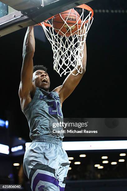 Xavier Sneed of the Kansas State Wildcats celebrates as he slams home a dunk against the Boston College Eagles in the second half during the Barclays...