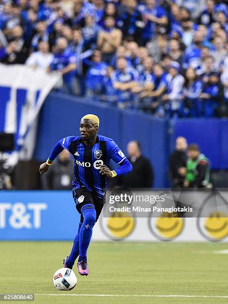 Ambroise Oyongo of the Montreal Impact runs with the ball during leg one of the MLS Eastern Conference finals against the Toronto FC at Olympic...