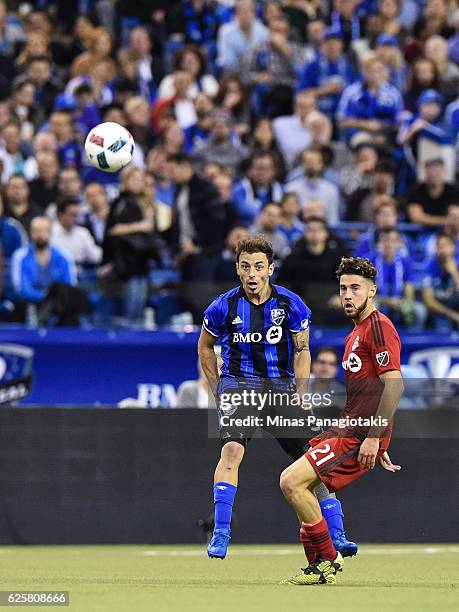 Hernan Bernardello of the Montreal Impact and Jonathan Osorio of the Toronto FC watch the ball during leg one of the MLS Eastern Conference finals at...