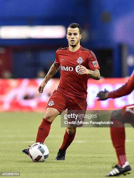 Sebastian Giovinco of the Toronto FC runs with the ball during leg one of the MLS Eastern Conference finals against the Montreal Impact at Olympic...