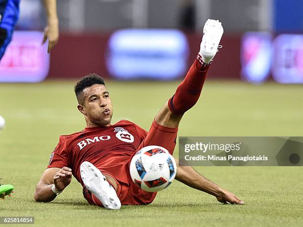 Justin Morrow of the Toronto FC falls during leg one of the MLS Eastern Conference finals against the Montreal Impact at Olympic Stadium on November...