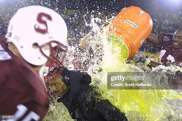 Stanford players dump Gatorade on head coach Tyrone Willingham after a close win over Notre Dame, 17-13, at Stanford Stadium in Palo Alto,...