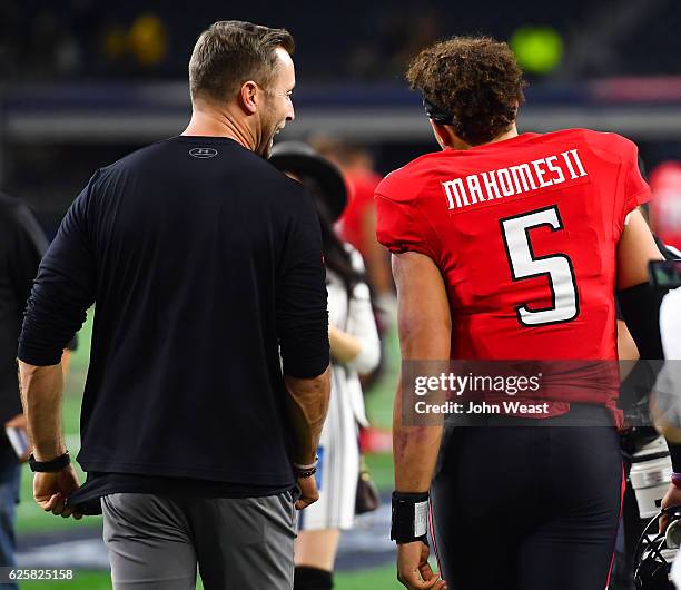 Head coach Kliff Kingsbury of the Texas Tech Red Raiders and Patrick Mahomes II of the Texas Tech Red Raiders leave the field after the game against...