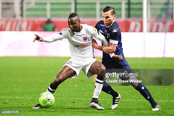 Joseph Romeric Lopy of Clermont and Karim Azamoum of Troyes during the French Ligue 2 between Troyes and Clermont at Stade de l'Aube on November 25,...
