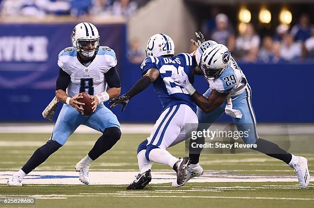 Marcus Mariota of the Tennessee Titans is pursued by Vontae Davis of the Indianapolis Colts during a game at Lucas Oil Stadium on November 20, 2016...