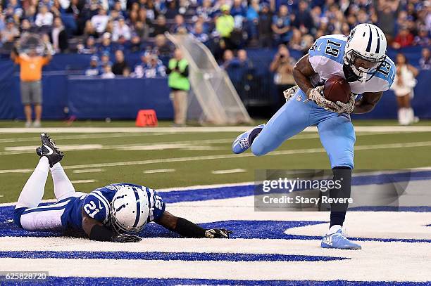 Tajae Sharpe of the Tennessee Titans catches a touchdown pass in front of Vontae Davis of the Indianapolis Colts during a game at Lucas Oil Stadium...