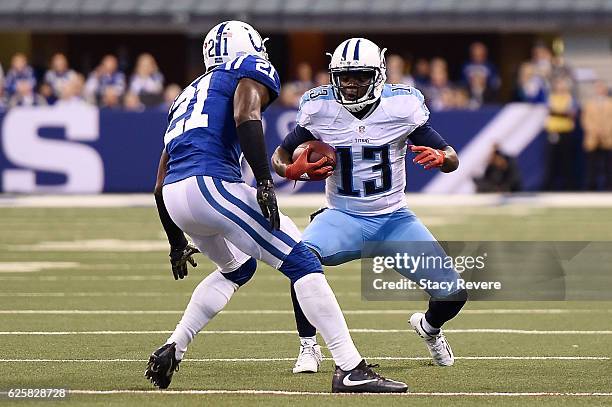 Kendall Wright of the Tennessee Titans is brought down by Vontae Davis of the Indianapolis Colts during a game at Lucas Oil Stadium on November 20,...