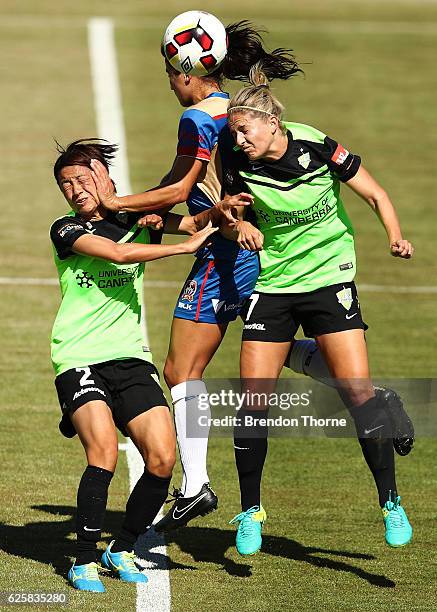 Jennifer Hoy of the Jets competes with Yukari Kinga and Ellie Brush of Canberra during the round four W-League match between Canberra United and the...