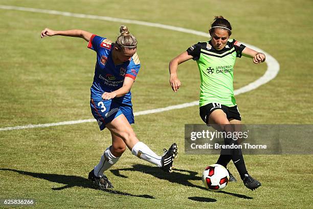 Elizabeth O'Reilly of the Jets competes with Ashleigh Sykes of Canberra during the round four W-League match between Canberra United and the...