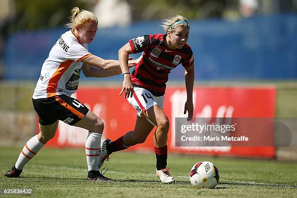 Alex Arlitt of the Wanderers takes on Clare Polkinghorne of the Roar during the round four W-League match between the Western Sydney Wanderers and...