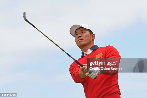 Ashun Wu of China plays an approach shot during day three of the World Cup of Golf at Kingston Heath Golf Club on November 26, 2016 in Melbourne,...