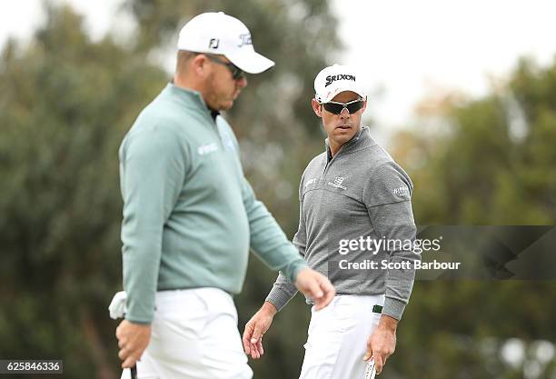 Jaco Van Zyl and George Coetzee of South Africa look on during day three of the World Cup of Golf at Kingston Heath Golf Club on November 26, 2016 in...