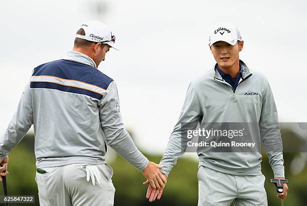 Ryan Fox and Danny Lee of New Zealand celebrate a birdie during day three of the World Cup of Golf at Kingston Heath Golf Club on November 26, 2016...