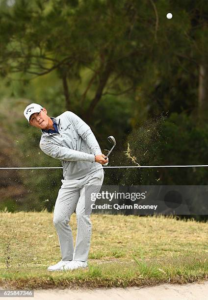 Danny Lee of New Zealand chips during day three of the World Cup of Golf at Kingston Heath Golf Club on November 26, 2016 in Melbourne, Australia.