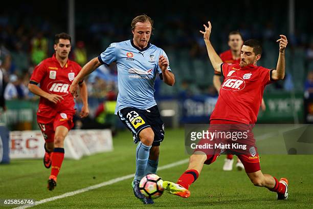 Rhyan Grant of Sydney FC is tackled by Iacopo La Rocca of United during the round eight A-League match between Sydney FC and Adelaide United at...