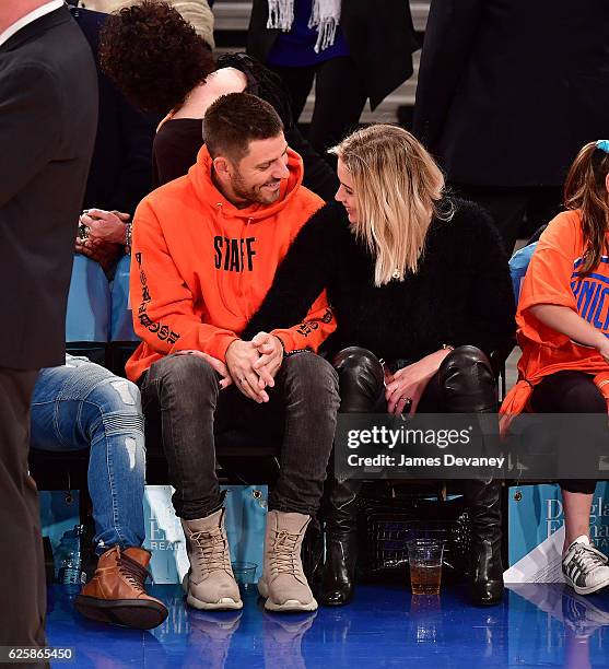 Ashley Benson and guest attend New York Knicks vs Charlotte Hornets game at Madison Square Garden on November 25, 2016 in New York City.