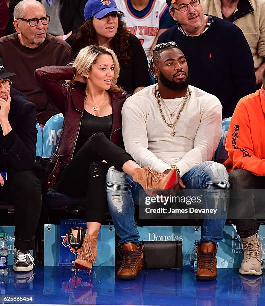 Landon Collins and guest attend New York Knicks vs Charlotte Hornets game at Madison Square Garden on November 25, 2016 in New York City.