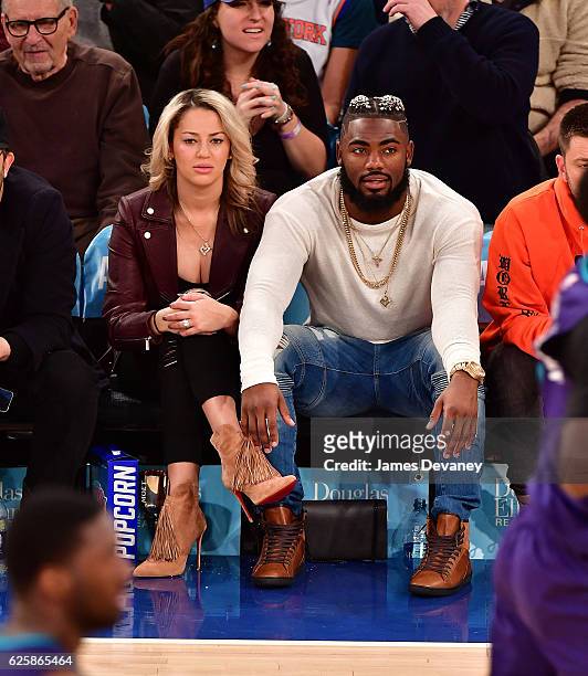 Landon Collins and guest attend New York Knicks vs Charlotte Hornets game at Madison Square Garden on November 25, 2016 in New York City.