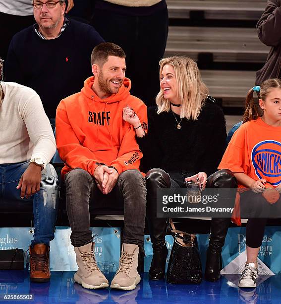 Ashley Benson and guest attend New York Knicks vs Charlotte Hornets game at Madison Square Garden on November 25, 2016 in New York City.