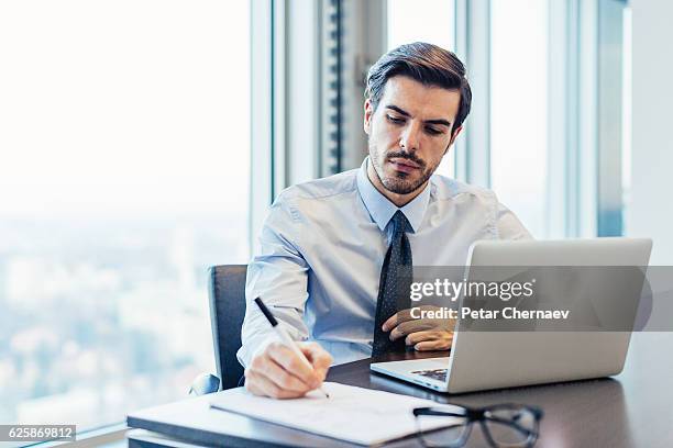 businessman in the office - answering stock pictures, royalty-free photos & images