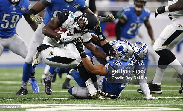 Yeldon of the Jacksonville Jaguars runs the ball and tackled by Miles Killebrew of the Detroit Lions at Ford Field on November 20, 2016 in Detroit,...