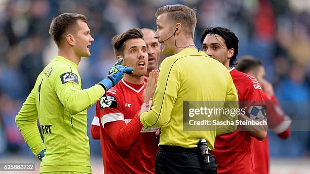 Players of Aalen protest at referee Arne Aarnink during the 3. Liga match between MSV Duisburg and VfR Aalen at Schauinsland-Reisen-Arena on November...