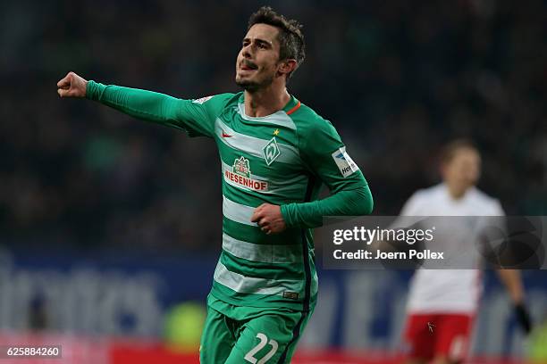 Fin Bartesl of Bremen celebrates after scoring his team's first goal during the Bundesliga match between Hamburger SV and Werder Bremen at...