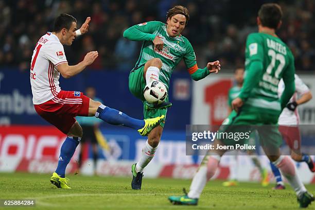 Filip Kostic of Hamburg and Clemens Fritz of Bremen compete for the ball during the Bundesliga match between Hamburger SV and Werder Bremen at...