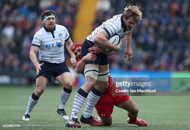 Richie Gray of Scotland is tackled by Merab Sharikadze of Georgia during the Autumn Test Match between Scotland and Georgia at Rugby Park on November...