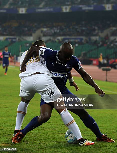 Chennaiyin FC's forward Dudu Omagbemi vies for the ball against NorthEast United FC's defender Mailson Alves during the Indian Super League football...