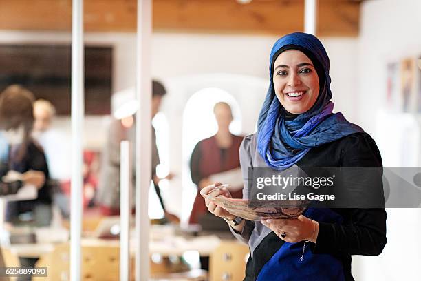 fashion design startup business - muslim women group stock pictures, royalty-free photos & images