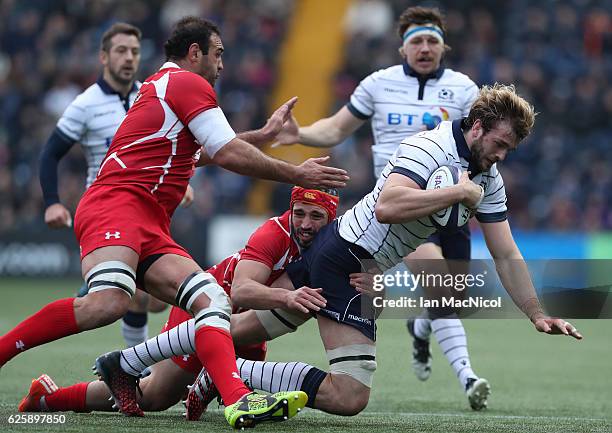 Richie Gray of Scotland is tackled by Merab Sharikadze of Georgia during the Autumn Test Match between Scotland and Georgia at Rugby Park on November...