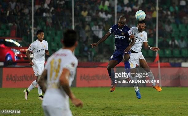 Chennaiyin FC's forward Dudu Omagbemi vies for the ball with NorthEast United FC's defender Shouvik Ghosh during the Indian Super League football...